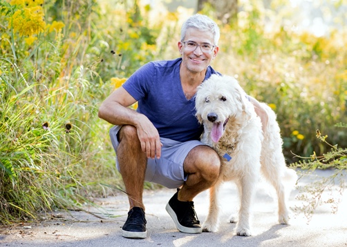 Photo of Primary User Persona white male in 50s with dog