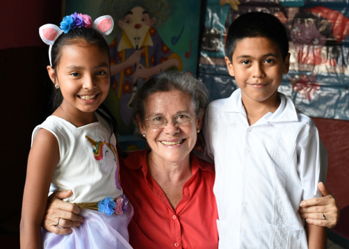 photo of a 50 year old school teacher with two children